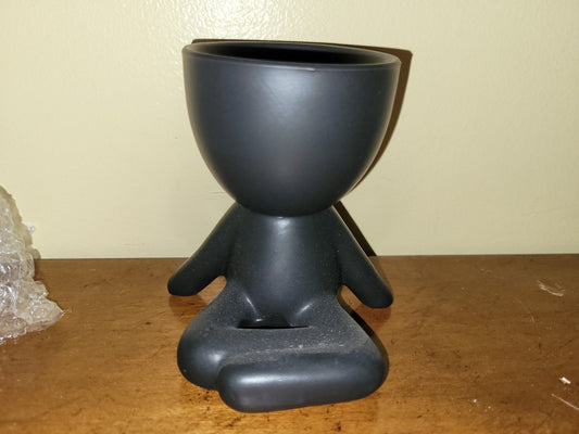 Sitting Person Black Container